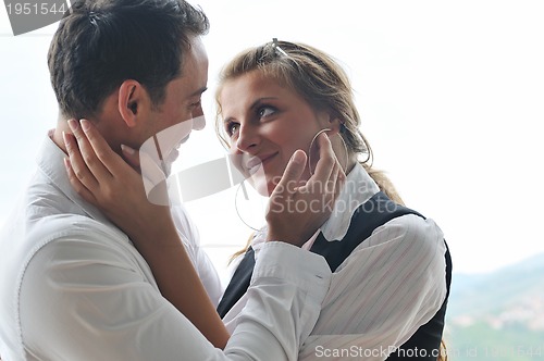 Image of romantic happpy couple on balcony