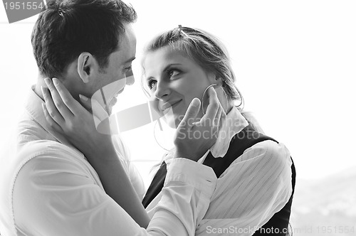 Image of romantic happpy couple on balcony 