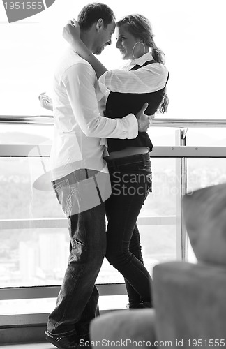 Image of romantic happpy couple on balcony 