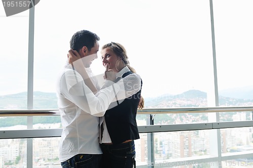Image of romantic happpy couple on balcony 