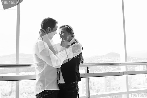 Image of romantic happpy couple on balcony 