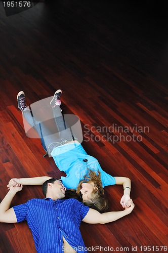 Image of happy couple in empty apartment