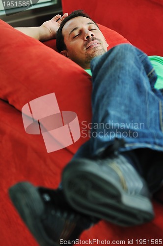 Image of man relaxing on sofa 