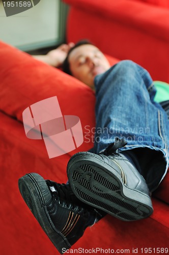 Image of man relaxing on sofa 