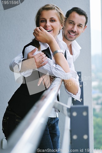 Image of romantic happpy couple on balcony 
