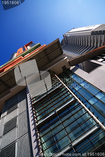 Image of modern building at sunny day and clear blue sky