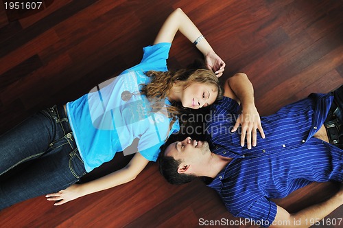 Image of happy couple in empty apartment