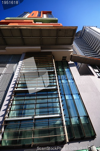 Image of modern building at sunny day and clear blue sky