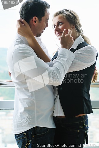 Image of romantic happpy couple on balcony 