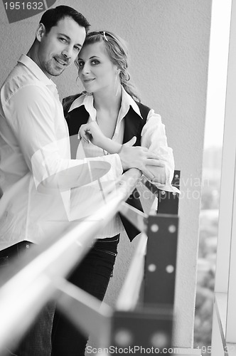 Image of romantic happpy couple on balcony 