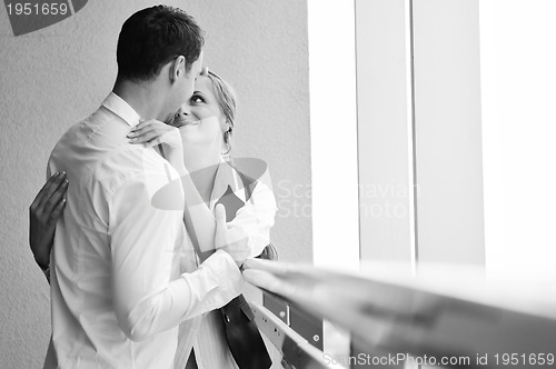 Image of romantic happpy couple on balcony 