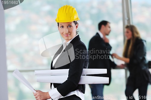 Image of happy young couple buying new home with real estate agent