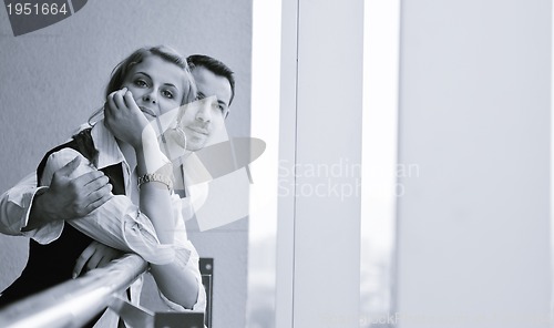 Image of romantic happpy couple on balcony 