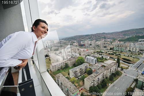 Image of woman looking on balcony