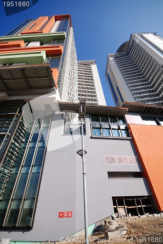 Image of modern building at sunny day and clear blue sky