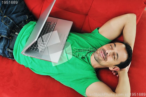 Image of man relaxing on sofa 