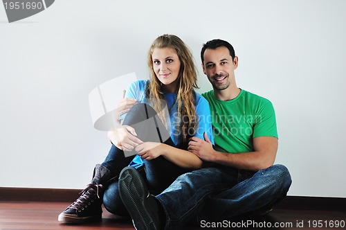 Image of happy couple in empty apartment