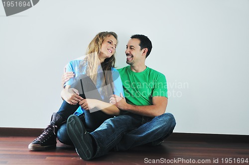 Image of happy couple in empty apartment