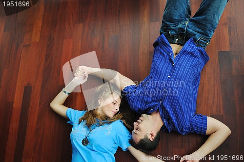 Image of happy couple in empty apartment