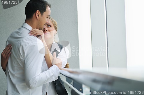 Image of romantic happpy couple on balcony