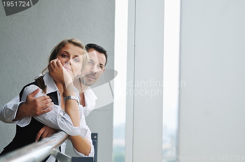 Image of romantic happpy couple on balcony