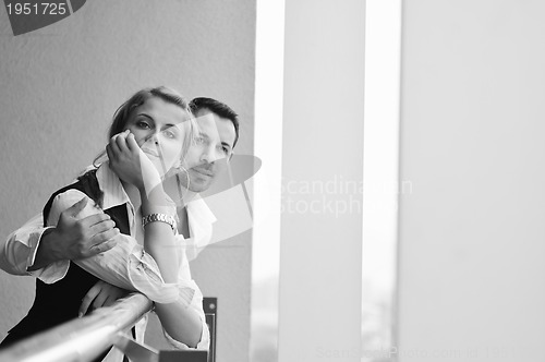 Image of romantic happpy couple on balcony