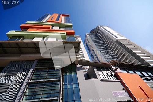 Image of modern building at sunny day and clear blue sky