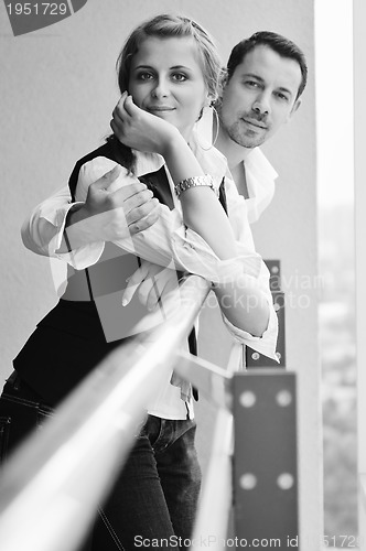 Image of romantic happpy couple on balcony