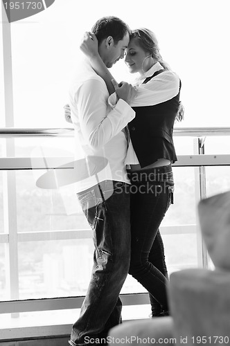 Image of romantic happpy couple on balcony