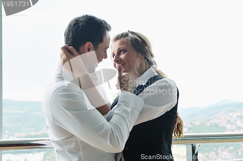 Image of romantic happpy couple on balcony