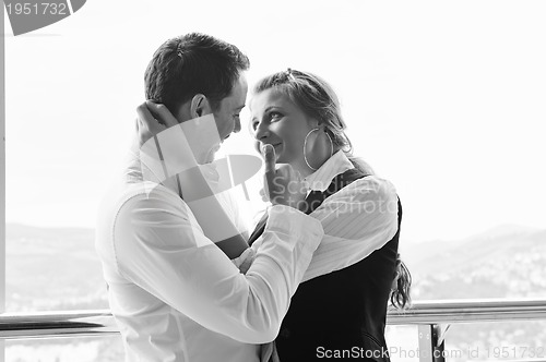 Image of romantic happpy couple on balcony