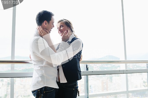 Image of romantic happpy couple on balcony