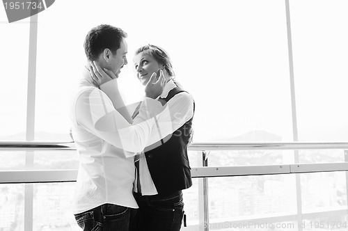 Image of romantic happpy couple on balcony