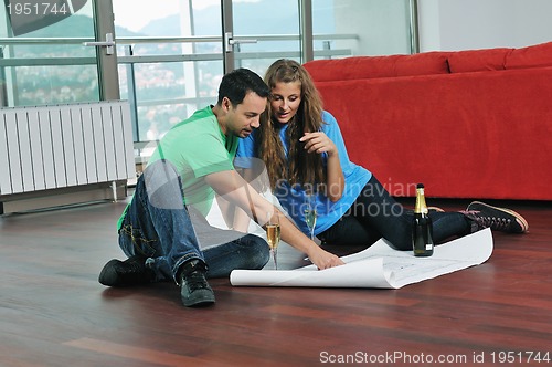 Image of happy couple planing new home