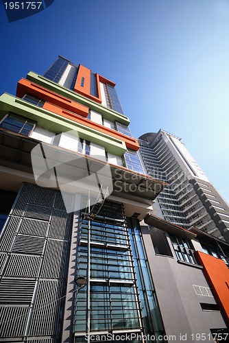 Image of modern building at sunny day and clear blue sky