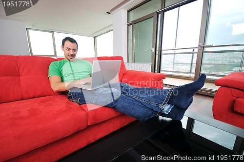 Image of happy couple in empty apartment