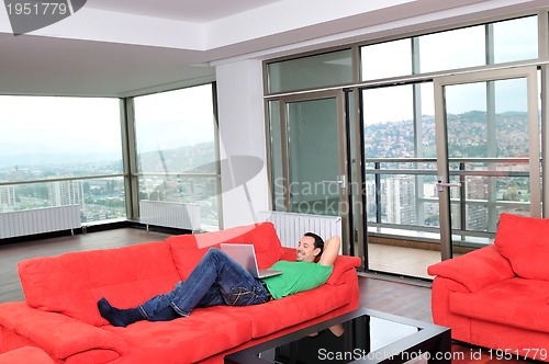 Image of happy couple in empty apartment