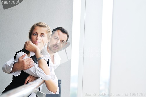 Image of romantic happpy couple on balcony