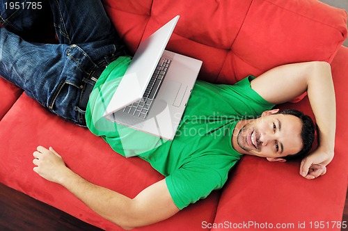 Image of happy couple in empty apartment