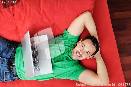 Image of happy couple in empty apartment