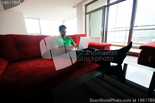 Image of happy couple in empty apartment