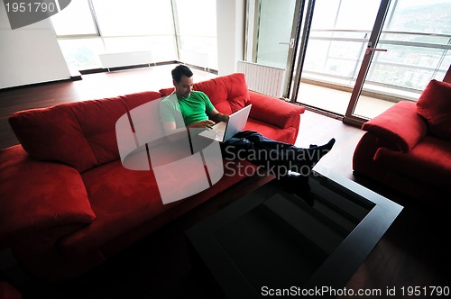 Image of happy couple in empty apartment