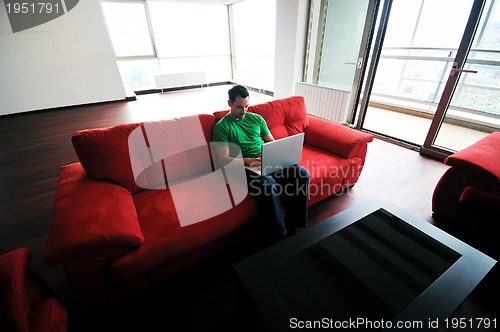 Image of happy couple in empty apartment