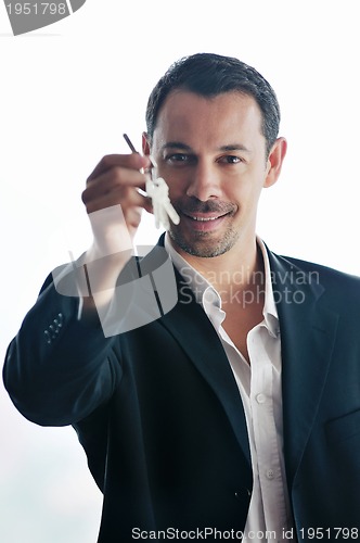 Image of isolated business man hold keys