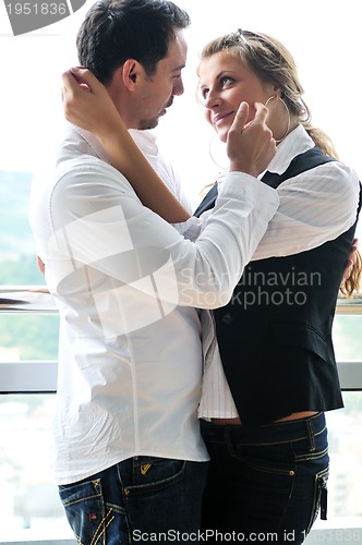 Image of romantic happpy couple on balcony