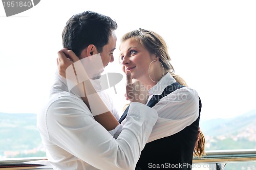 Image of romantic happpy couple on balcony