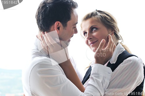 Image of romantic happpy couple on balcony