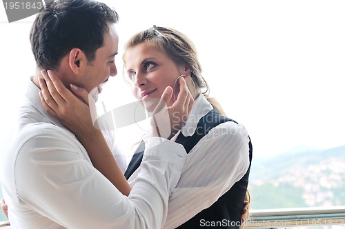 Image of romantic happpy couple on balcony