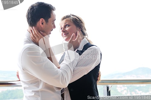 Image of romantic happpy couple on balcony