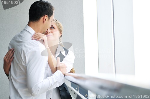 Image of romantic happpy couple on balcony